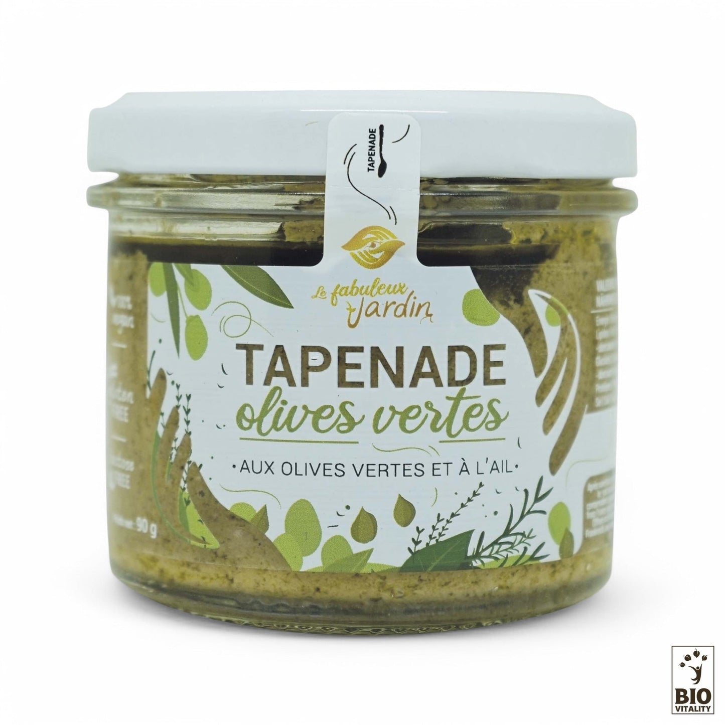 La Tapenade Olives Vertes Bio FABULEUX JARDIN - 90g est une pâte à tartiner vegan, sans gluten, aux olives vertes et à lail, étiquetée en français et en anglais, mettant en avant sa certification biologique et permaculturelle. Conditionnée dans un pot avec un couvercle blanc.