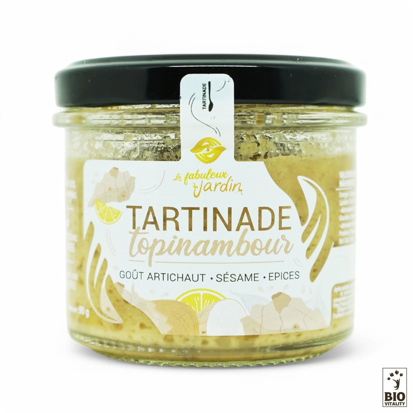 Le pot en verre de 90g de la tartinade Tartinade Topinambour Bio de FABULEUX JARDIN mêle artichaut, sésame et épices. Avec son couvercle noir et son joint blanc affichant ses labels Bio et vegan, il est gage de qualité. Dégustez ce délice crémeux et sans gluten !.