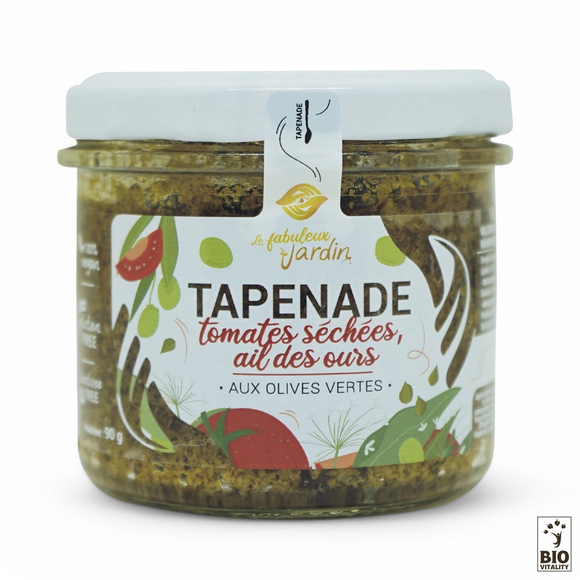 Le pot en verre de 90 g de Tapenade Olives Vertes, Tomates séchées & Ails des ours Bio de FABULEUX JARDIN est étiqueté en français avec des illustrations de légumes et dherbes aromatiques. Il comporte un logo bio en bas à droite et est végétalien et sans gluten.