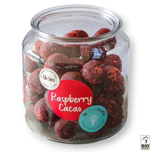 Un pot de 500g de Smart Truffes Framboise Cacao de LE SMART CAKE contient de délicieuses truffes au cacao et à la framboise, végétaliennes et sans gluten.